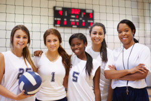 Volleyball team with coach